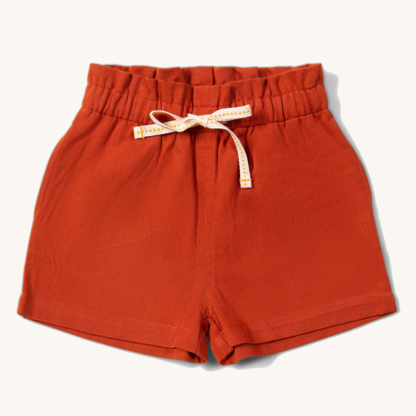 Soft Red By The Sea Twill Shorts. Made from GOTS Organic Cotton, these shorts have a white and yellow drawstring, and paperbag waist