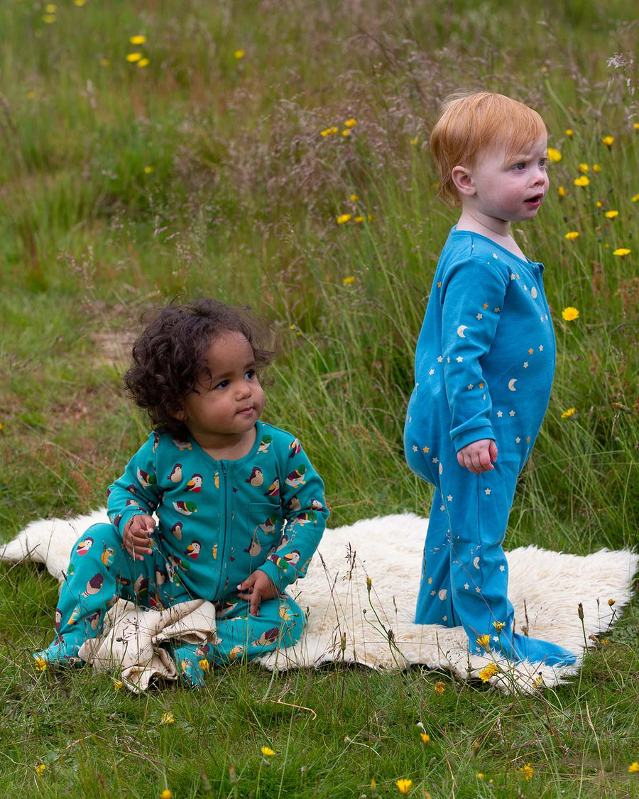  this beautiful blue babygrow features moon and start patters