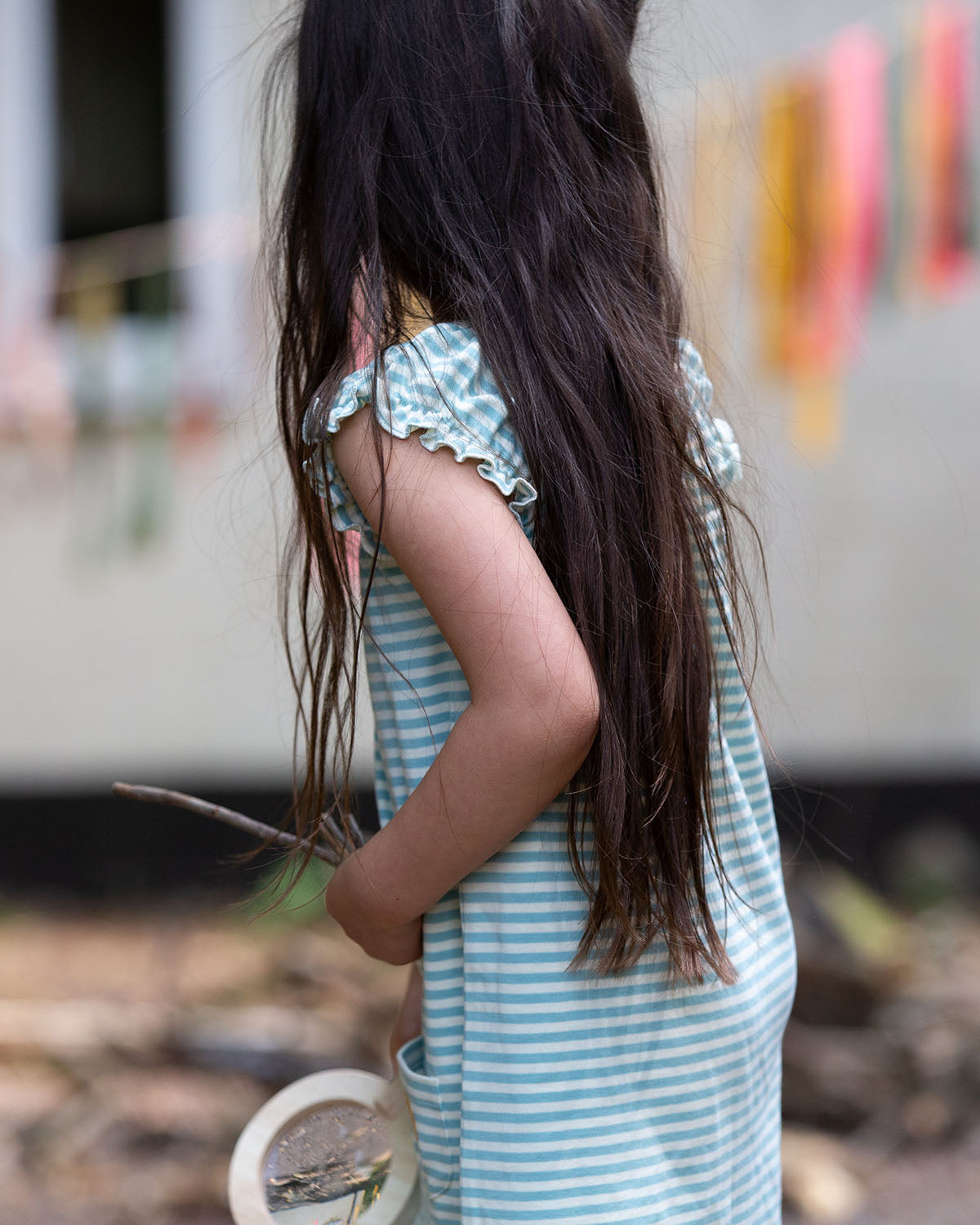  holding a magnifying glass and sticks