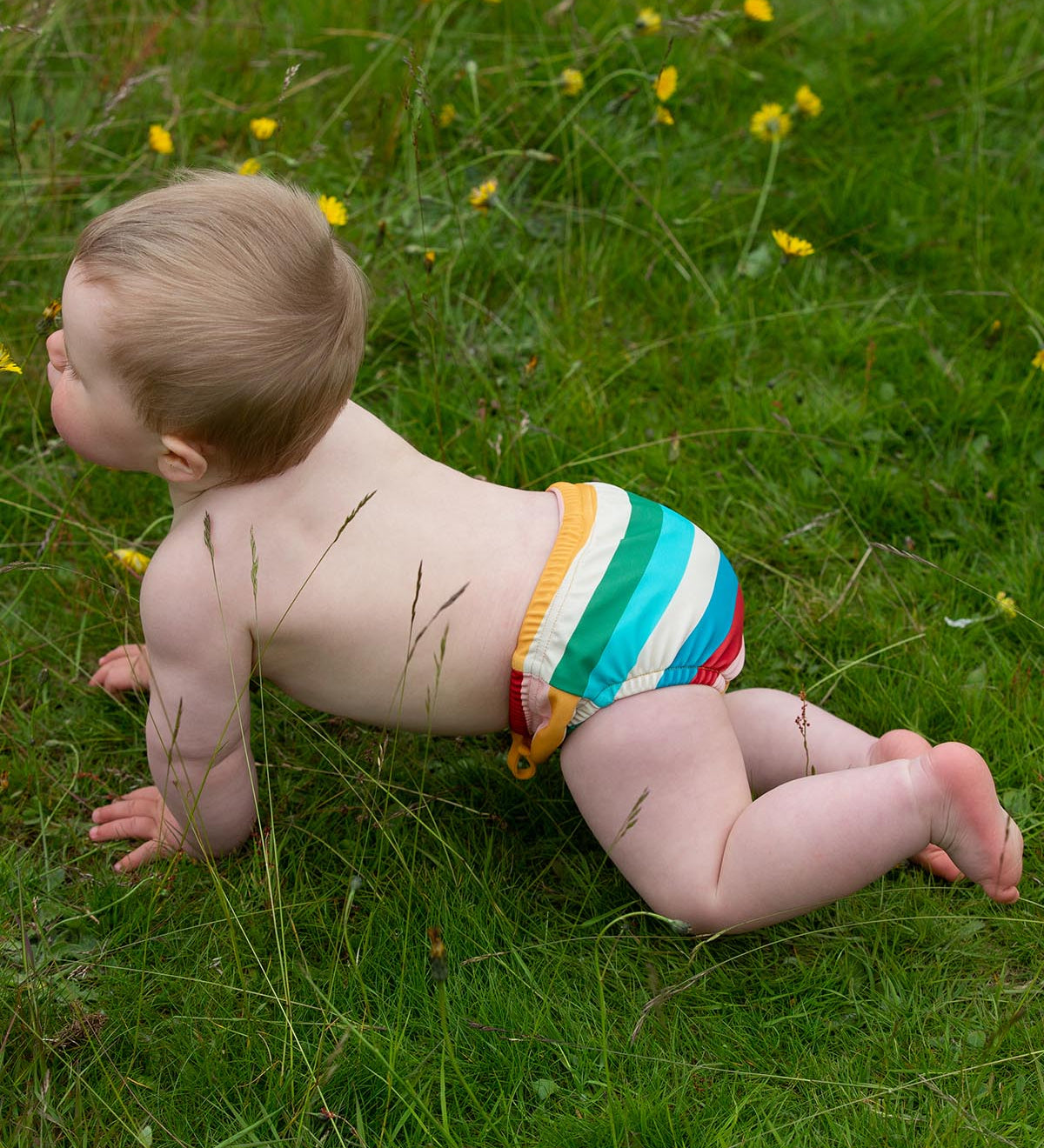  this fun rainbow striped swimming nappy comes with an elastic drawstring at the front