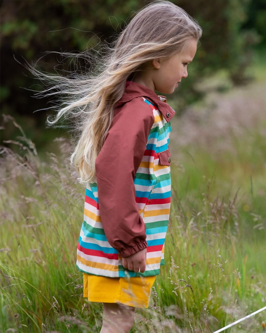 The back of the Little Green Radicals Rainbow Striped Recycled Waterproof Windbreaker Jacket