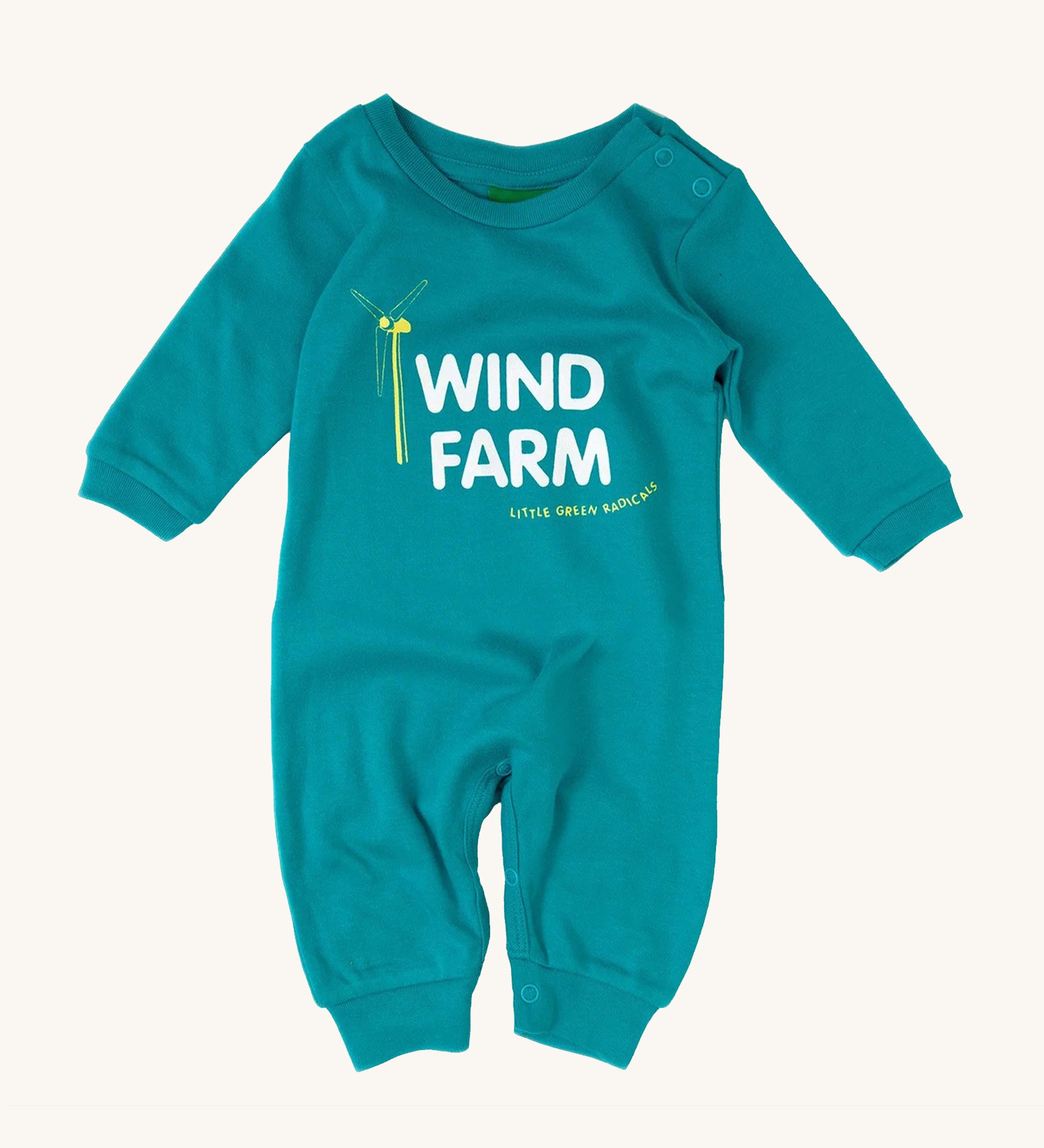 Little Green Radicals Wind Farm Organic Cotton Playsuit, in a light blue fabric, white lettering and a yellow wind turbine on a cream background