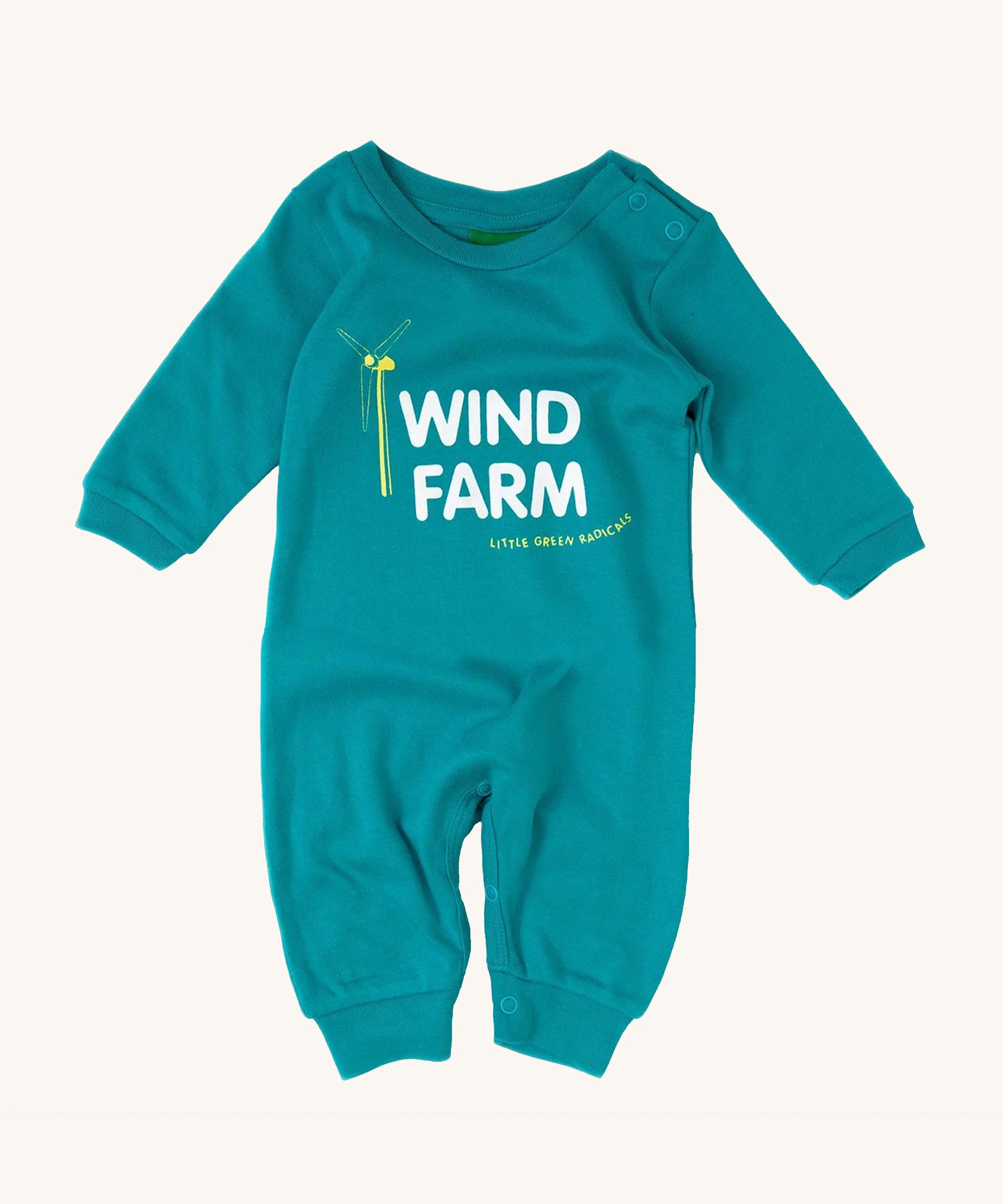 Little Green Radicals Wind Farm Organic Cotton Playsuit, in a light blue fabric, white lettering and a yellow wind turbine on a cream background