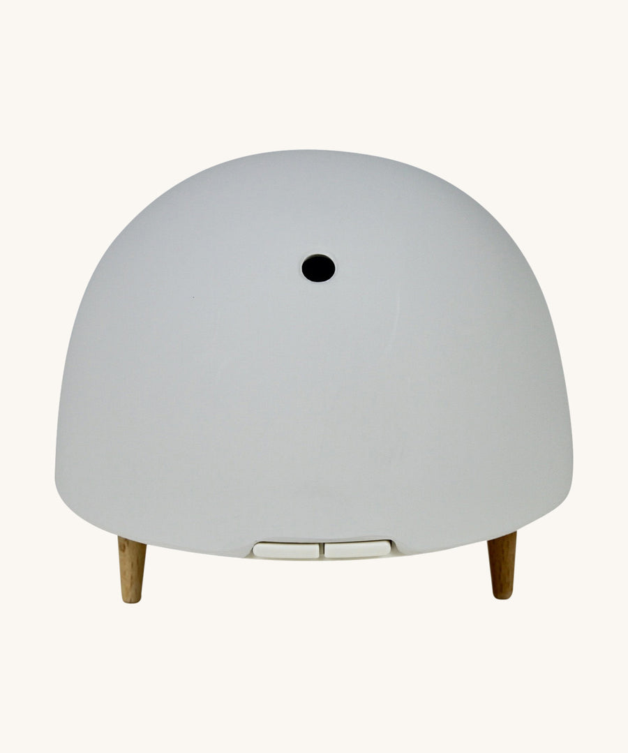 Maël Diffuser, a light grey dome plug-in essential oil diffuser with wooden feet. 