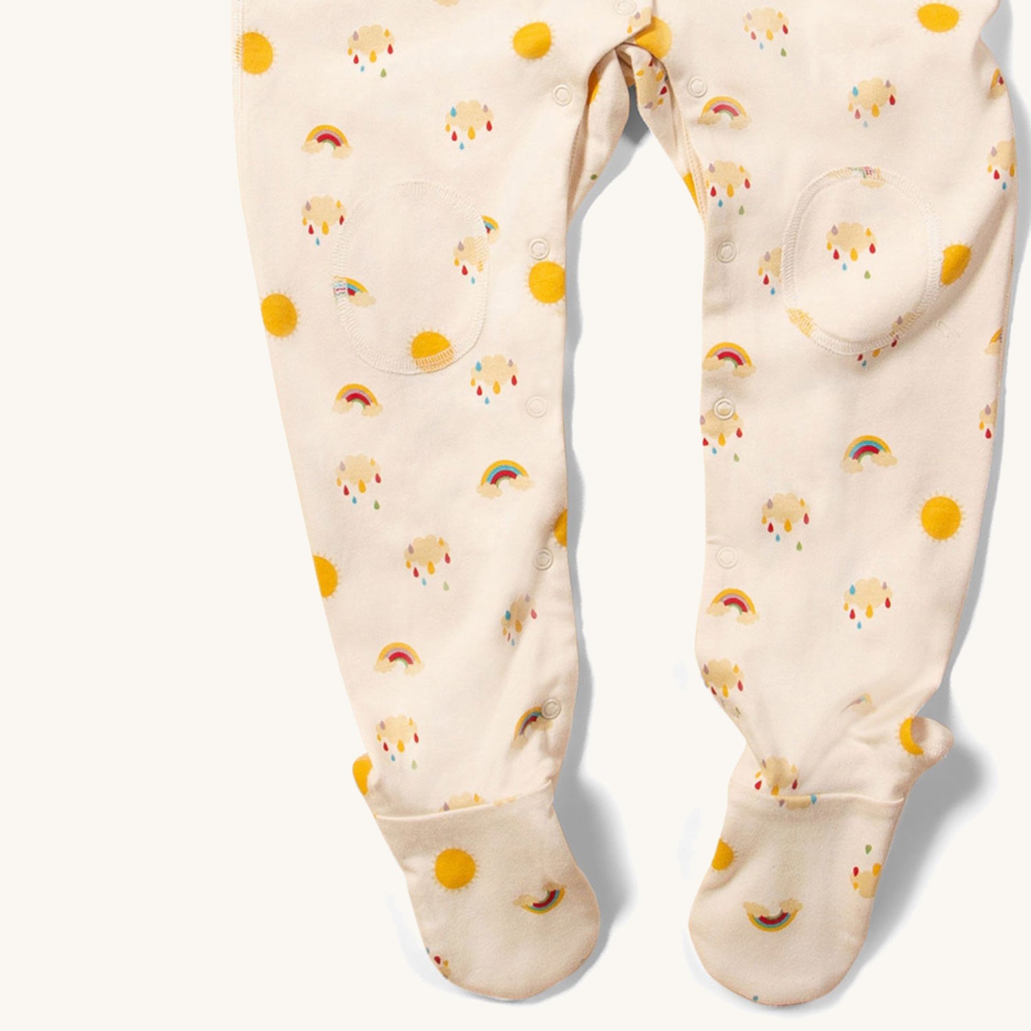 close up of the knee patched and fete covers on the LGR Adaptive Sunshine & Rainbows Sleepsuit