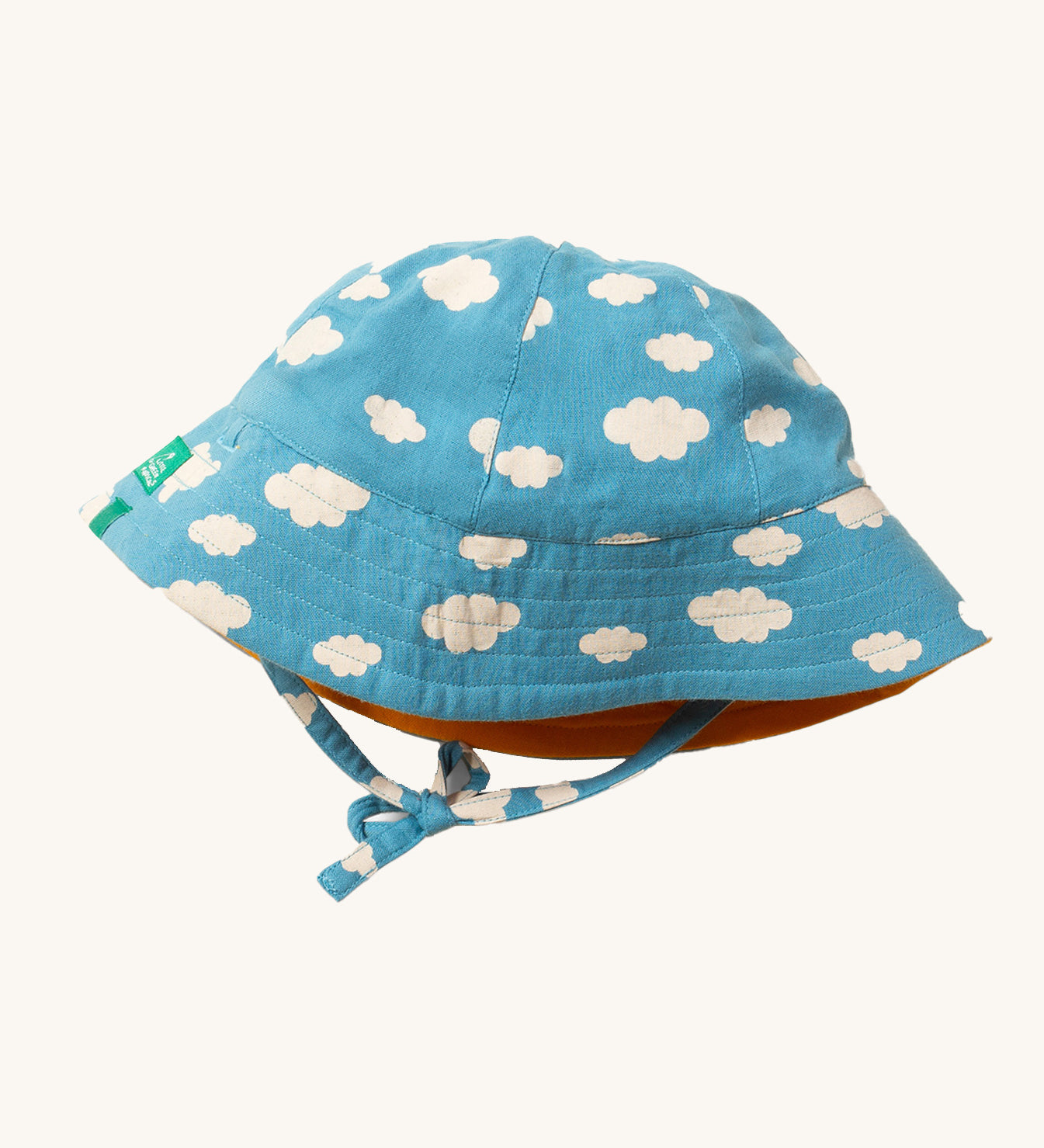 Little Green Radicals organic cotton Blue Clouds Reversible Baby Sun Hat, shown with the cloud print on the outside.