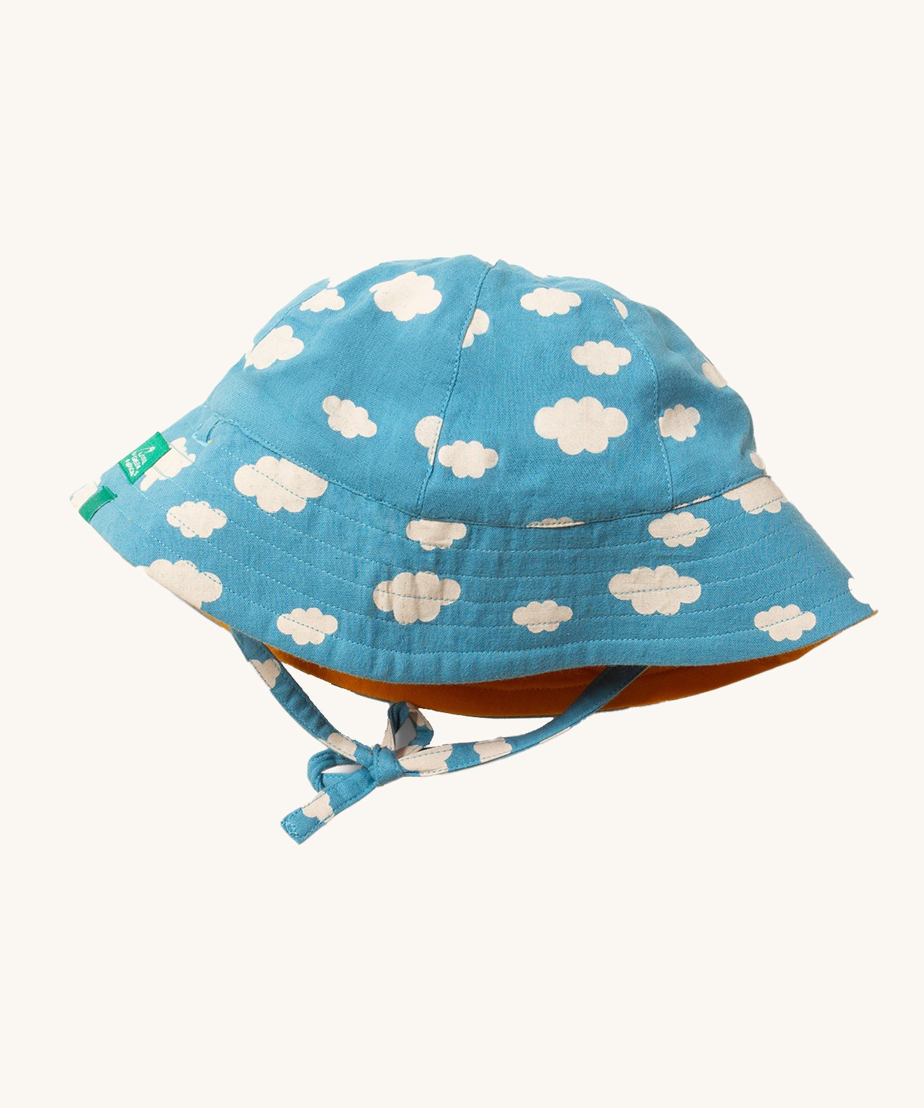 Little Green Radicals organic cotton Blue Clouds Reversible Baby Sun Hat, shown with the cloud print on the outside.