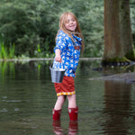 A side view of a child wearing the Little Green Radicals Diving And Splashing Blue Recycled Waterproof Kids Packable Anorak