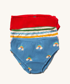 Little Green Radicals Organic Cotton Underwear Briefs Set in a 3 pack. One pair has a rainbow print on a blue background, one has multi coloured stripes and one is plain red.