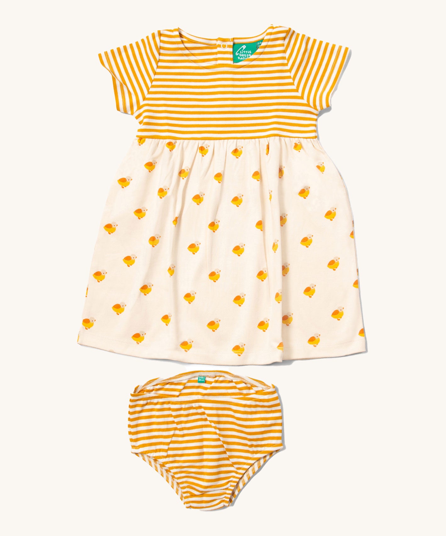 Little Green Radicals organic cotton Easy Peasy Summer Dress with a yellow stripe sleeve and upper body and a Little Ducks print skirt. Sizes up to 24 months have a matching pair of yellow striped nappy cover