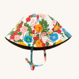 Little Green Radicals Flora and Fauna Reversible Sun Hat shown with the floral print on the outside.