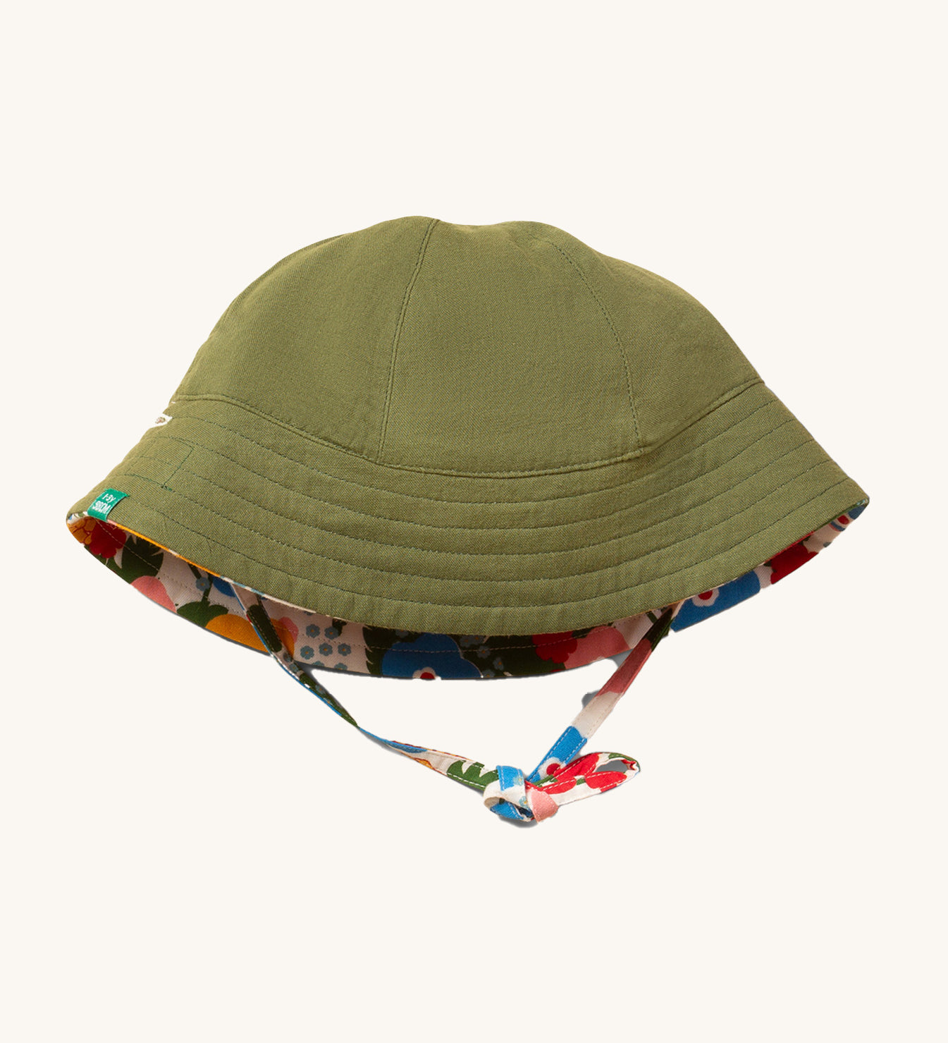 Little Green Radicals Flora and Fauna Reversible Sun Hat shown with the green plain side on the outside.