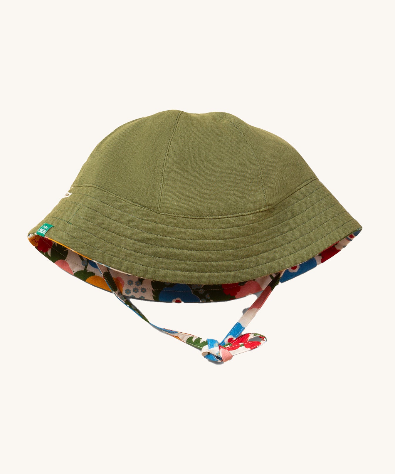 Little Green Radicals Flora and Fauna Reversible Sun Hat shown with the green plain side on the outside.