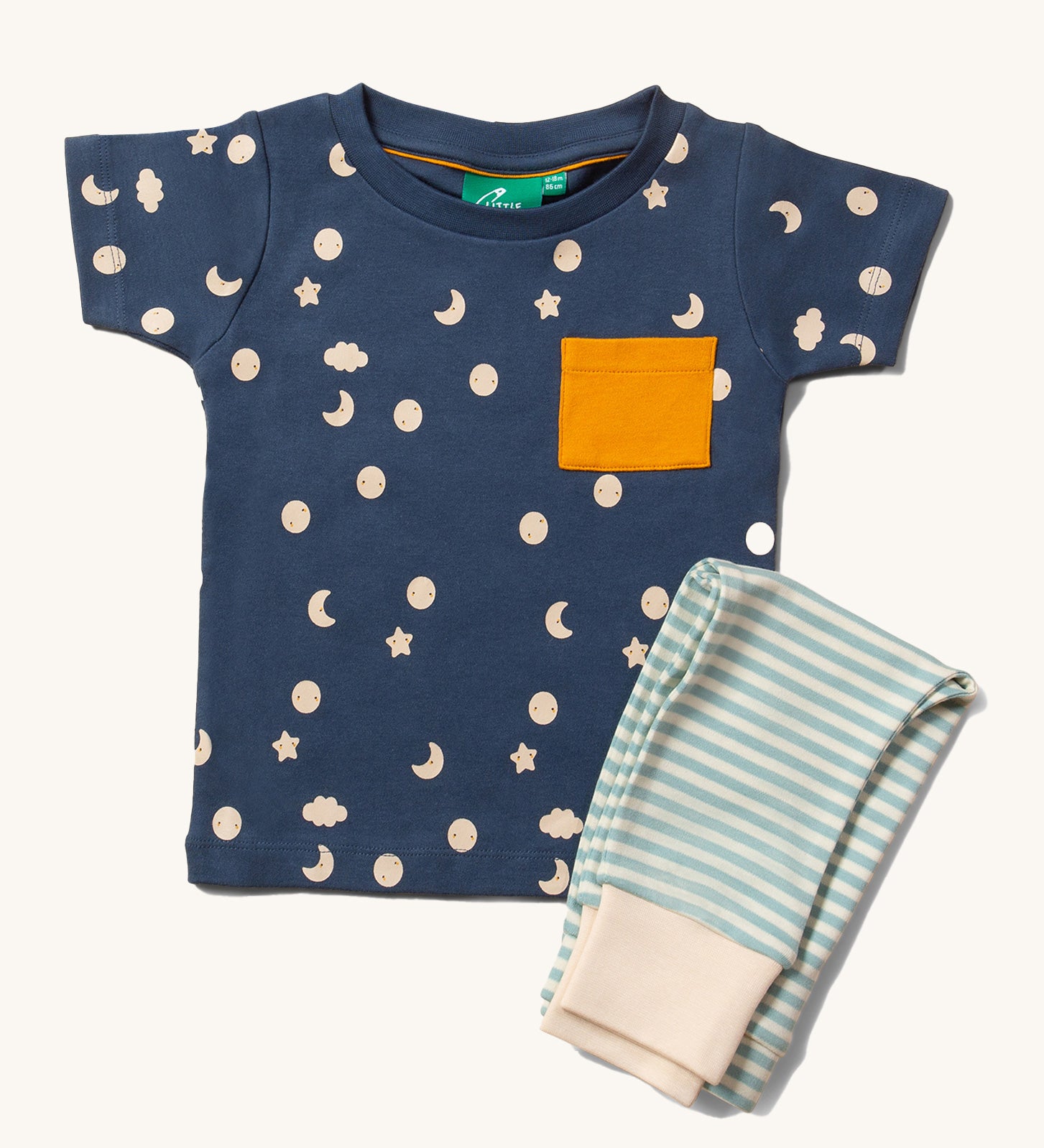 Little Green Radicals Organic Cotton Children's Full Moon T-Shirt & Jogger Set. The T-short has a moon and star print on a dark blue background with a yellow pocket, the joggers have a  blue and off white striped design. 