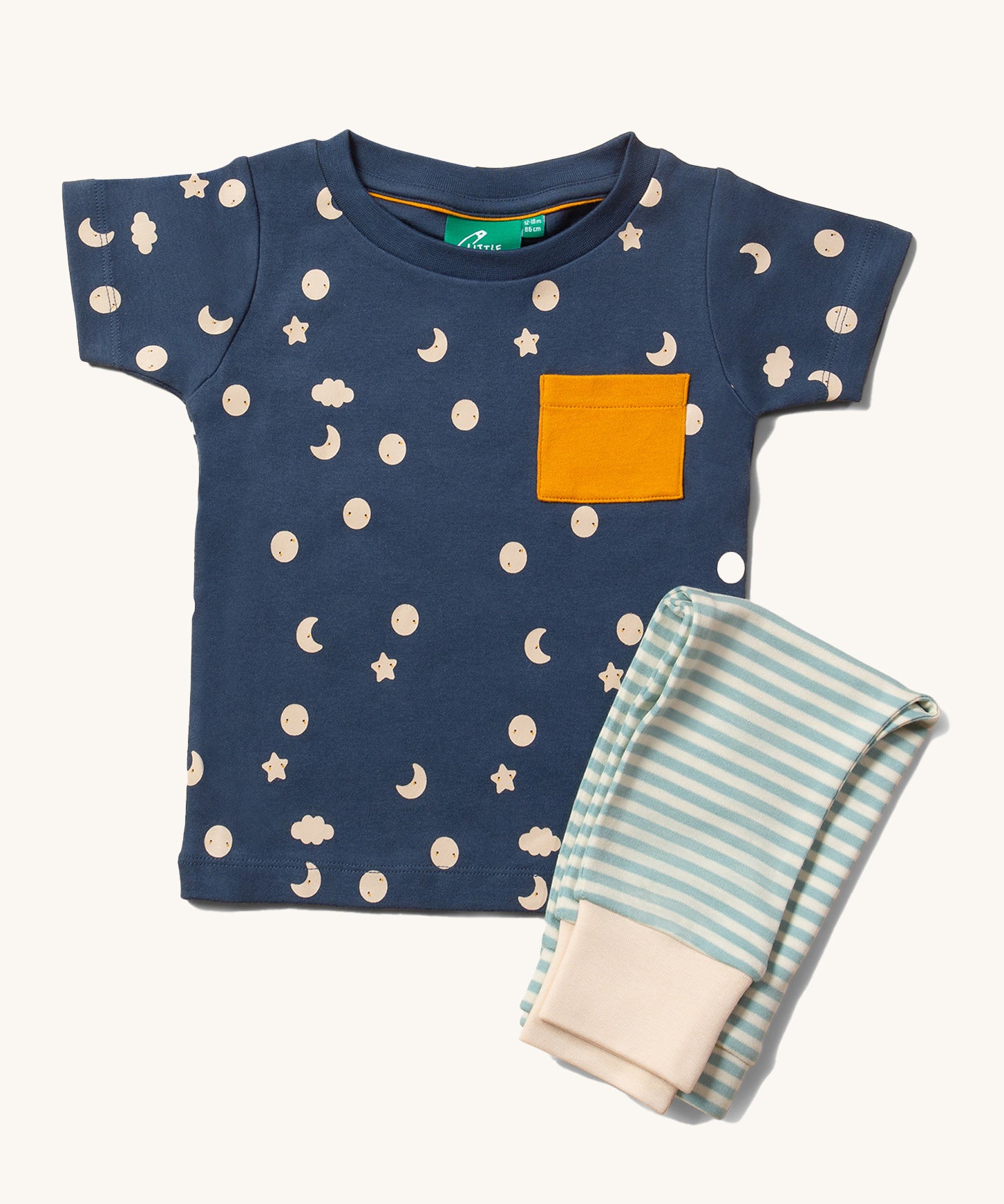 Little Green Radicals Organic Cotton Children's Full Moon T-Shirt & Jogger Set. The T-short has a moon and star print on a dark blue background with a yellow pocket, the joggers have a  blue and off white striped design. 