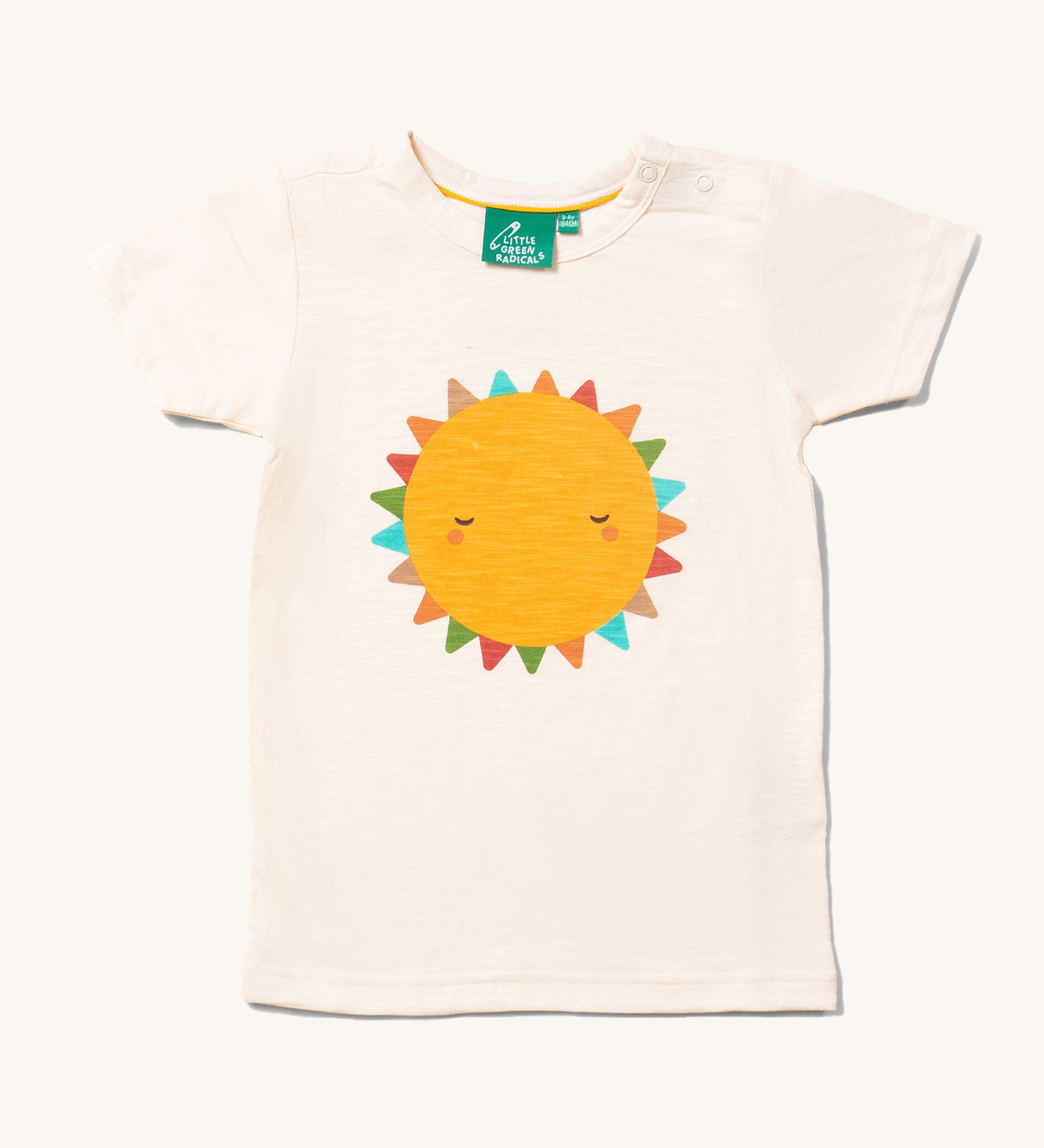 The Little Green Radicals Fun In The Sun Short Sleeve T-Shirt. A yellow coloured sun with rainbow coloured triangle shaped rays on an off white coloured organic cotton t-shirt.