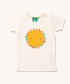 The Little Green Radicals Fun In The Sun Short Sleeve T-Shirt. A yellow coloured sun with rainbow coloured triangle shaped rays on an off white coloured organic cotton t-shirt.