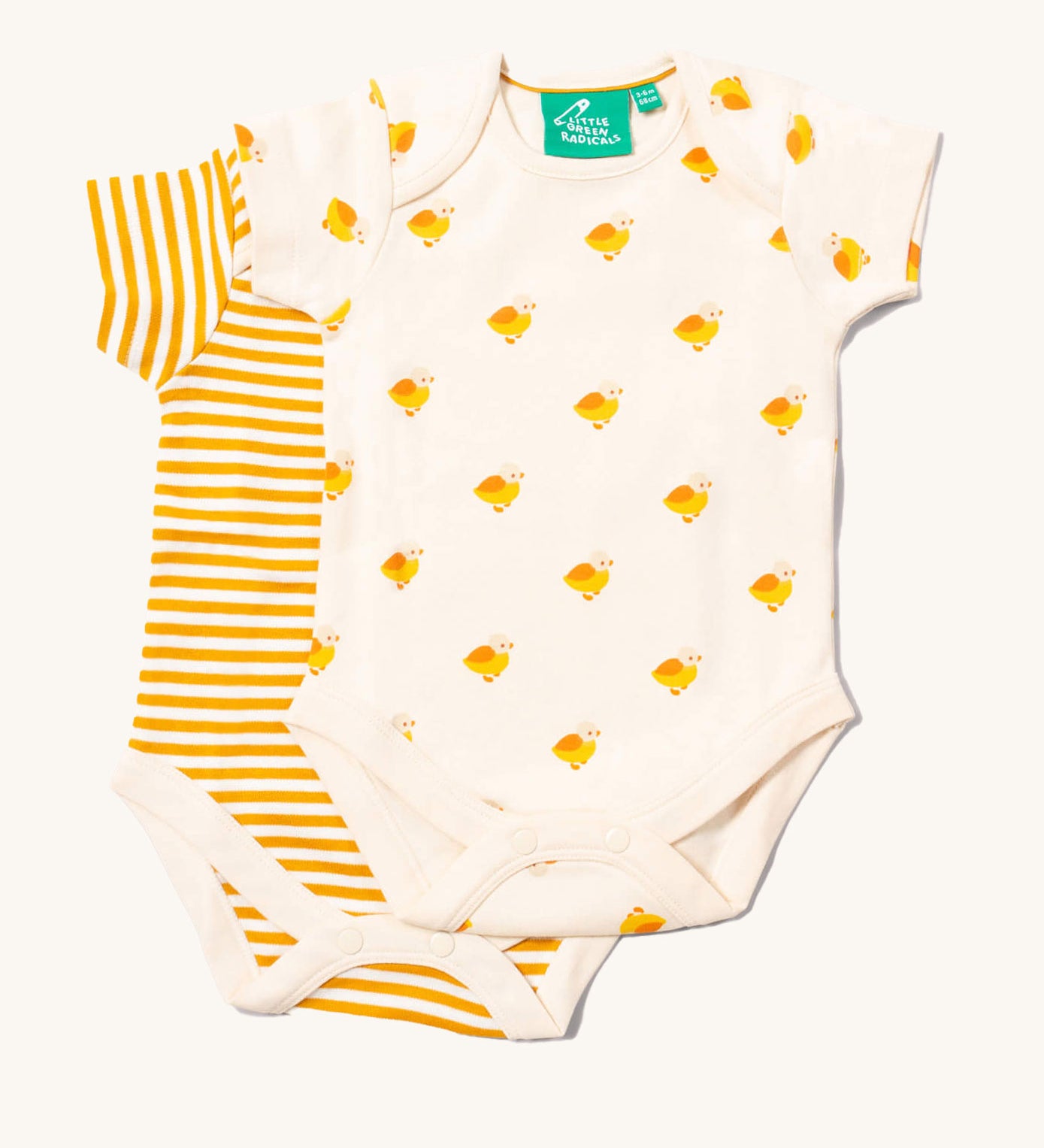 Little Green Radicals Little Ducks Organic 2 Pack Baby Body Set . One vest has an all over yellow coloured duck print on a cream background the other vest has a cream and yellow gold coloured stripe. 