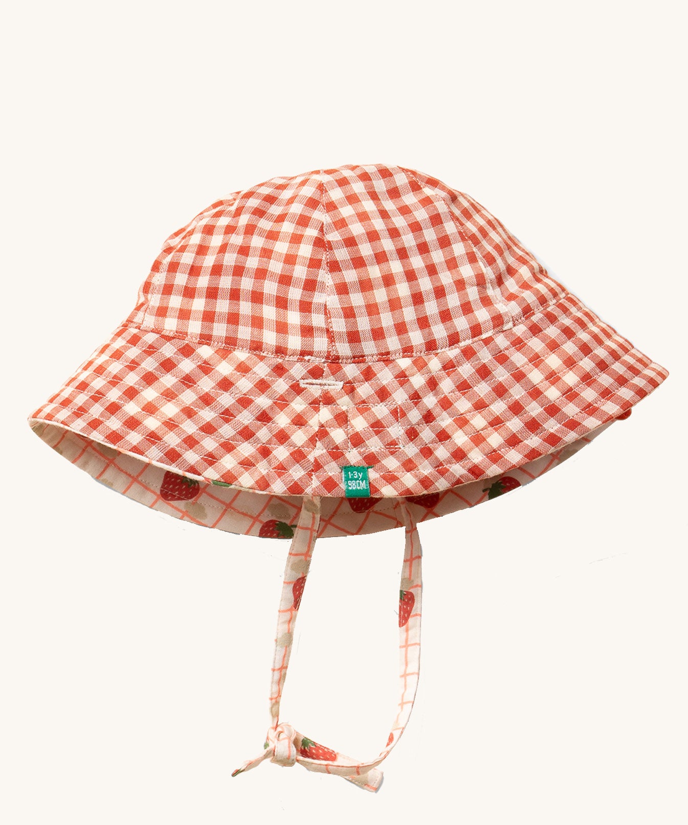 Little Green Radicals Strawberry Days Reversible Kids Sun Hat. The side with the red and cream gingham is shown.