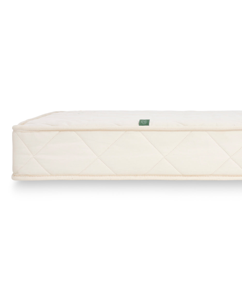 A side profile view of a Little Green Sheep mattress. 