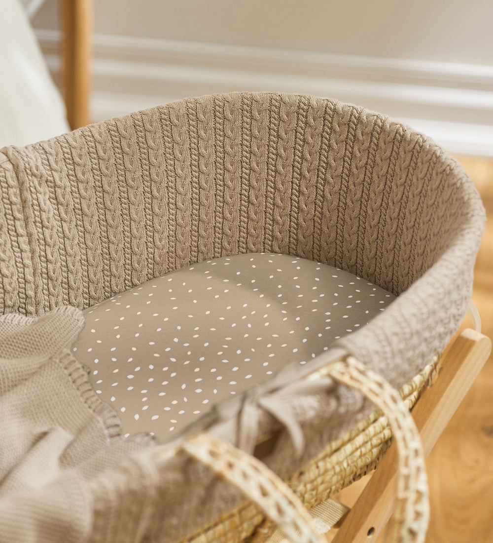 Little Green Sheep Organic Moses Basket Jersey Fitted Sheet in truffle rice pictured in a moses basket