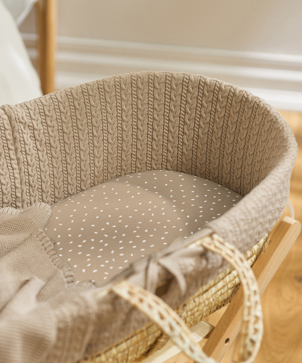 Little Green Sheep Organic Moses Basket Jersey Fitted Sheet in truffle rice pictured in a moses basket