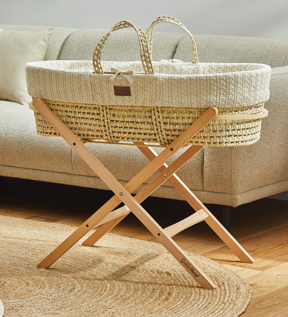 Little Green Sheep Organic Knitted Moses Basket & Mattress in linen pictured with optional folding stand