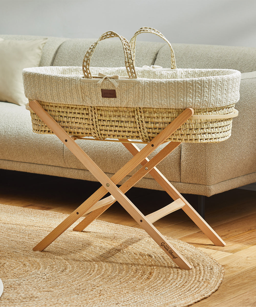 Little Green Sheep Organic Knitted Moses Basket & Mattress in linen pictured with optional folding stand