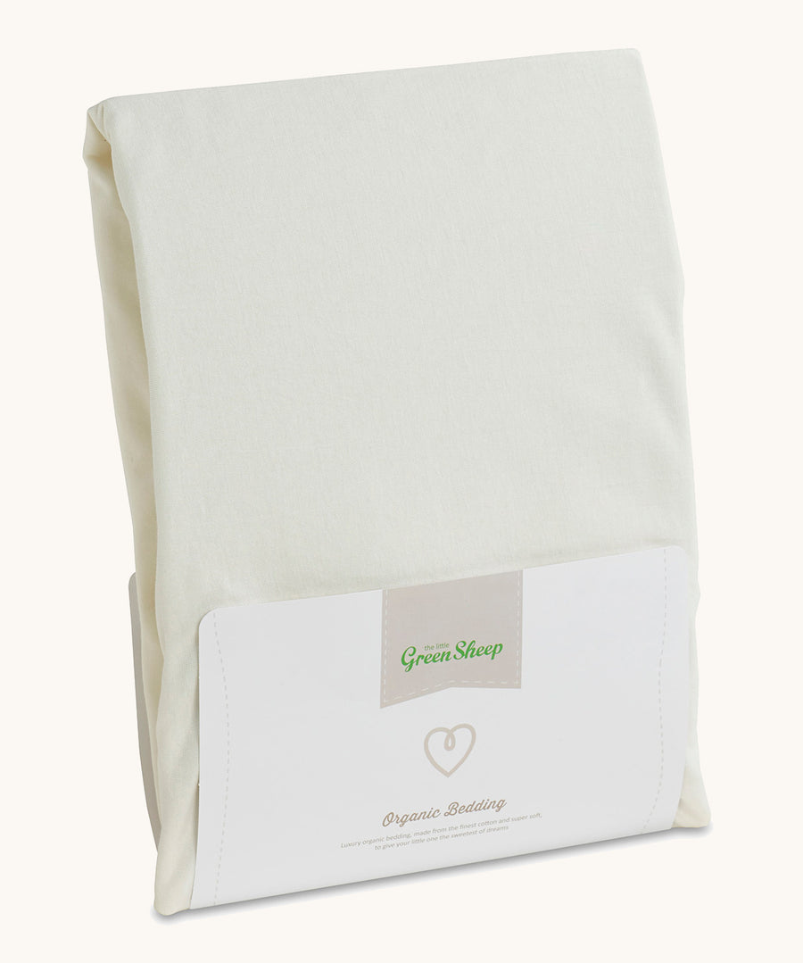 Little Green Sheep Organic Single Jersey Fitted Sheet in packaging pictured on a plain background