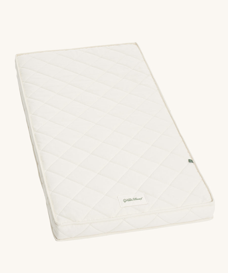 Little Green Sheep Twist Natural SnuzKot Mattress pictured on a plain background