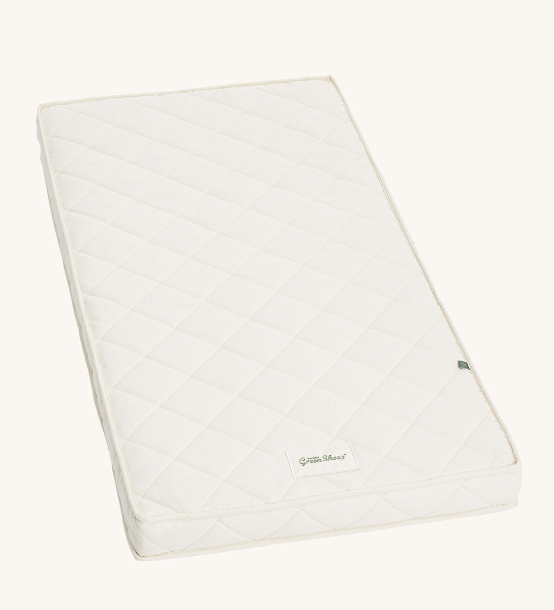 Little Green Sheep Twist Natural SnuzKot Mattress pictured on a plain background