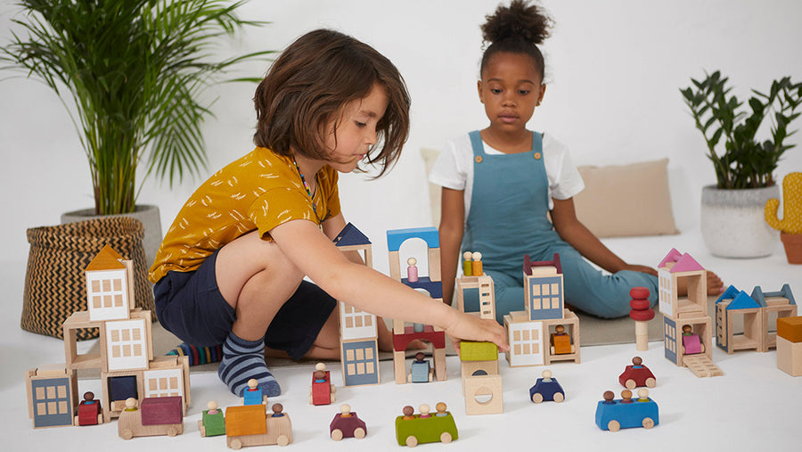 Kids playing with a Lubulona wooden city building block set