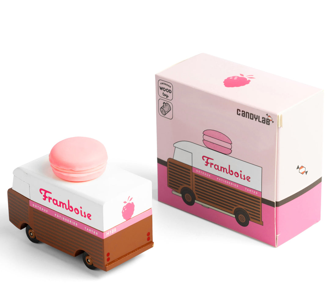 Picture of the Framboise Candylab Candyvan. with its box. It is a 1960s style brown and white van with a pink Raspberry Macaron on the roof.