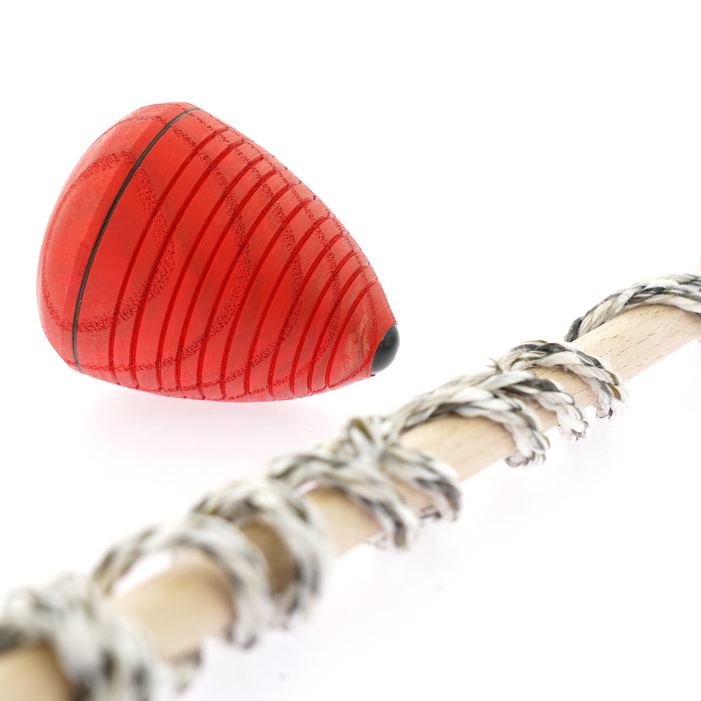 Close up of the Mader solid wooden whip top spinning toy on a white background