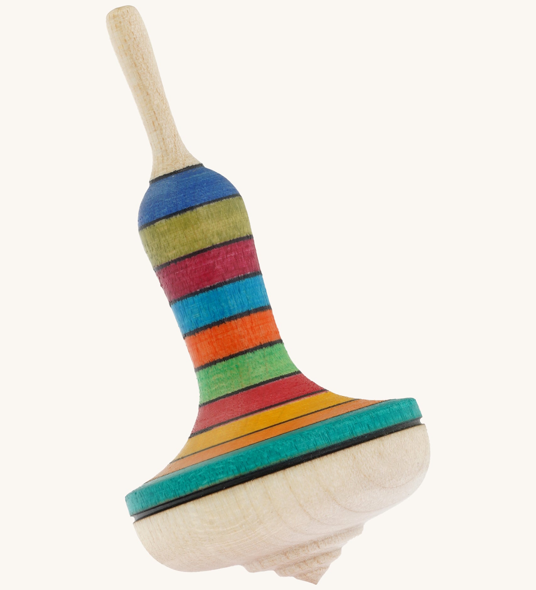 A wooden Mader manolette spinning top with a rainbow design on a cream background.