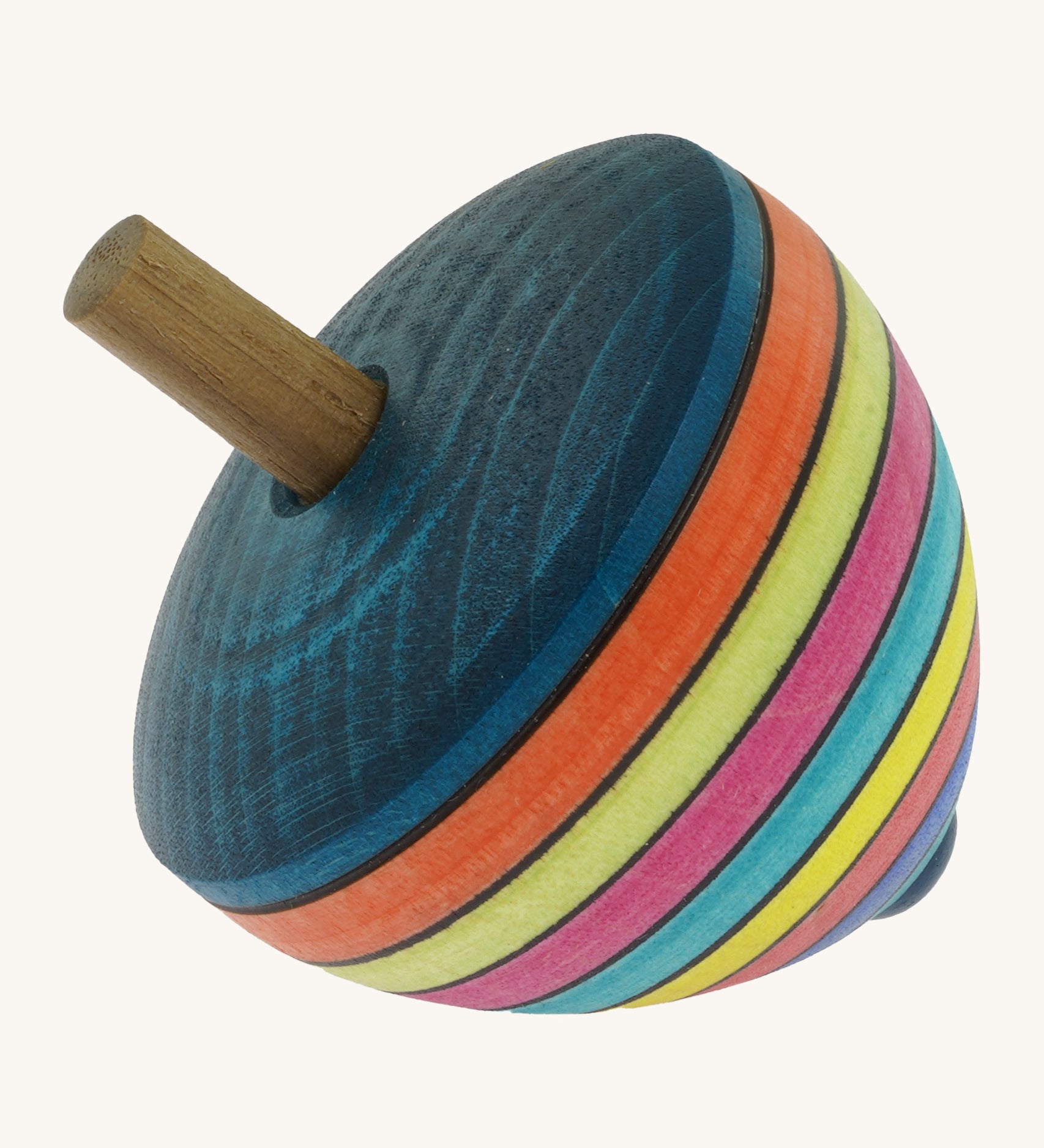 A wooden Mader dragon egg spinning top with multicoloured stripes on a cream background