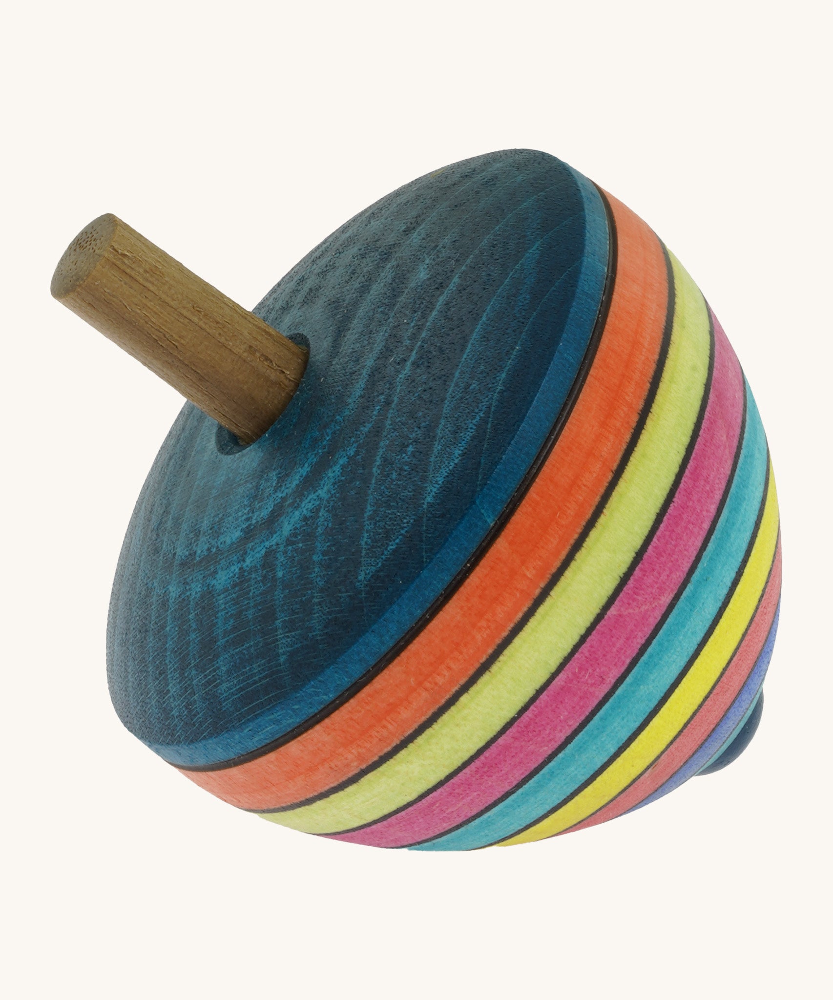 A wooden Mader dragon egg spinning top with multicoloured stripes on a cream background