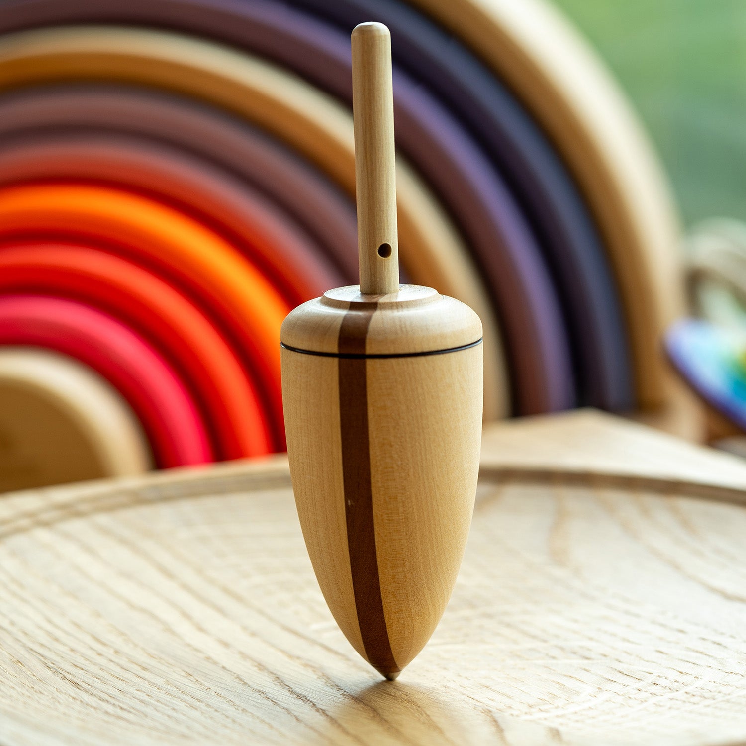 Mader Goliath Thunderbolt Spinning Top sits on a spinning plate.