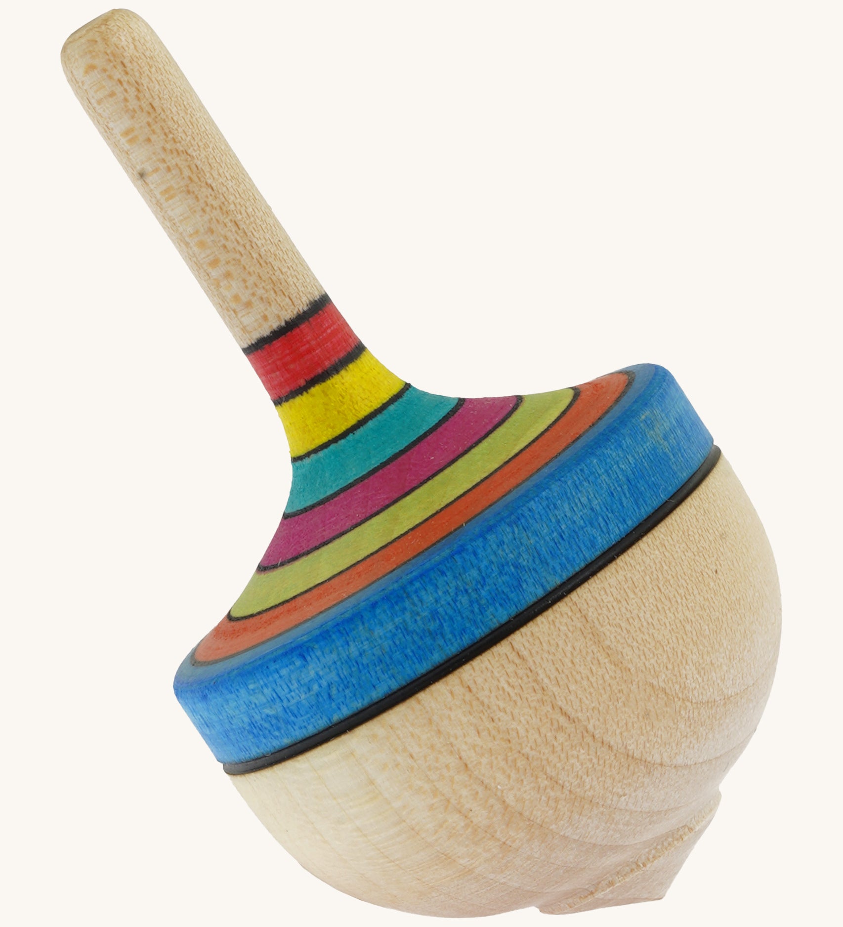 A wooden Mader traditional rainbow spinning top on a cream background.