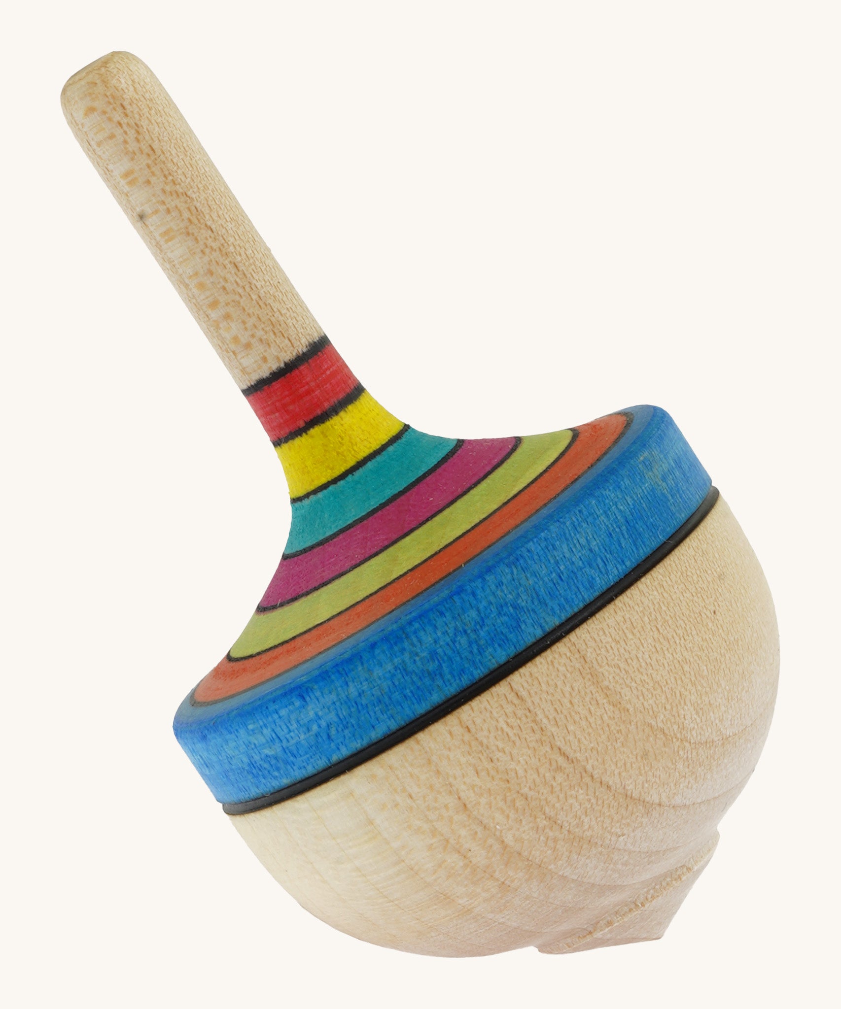 A wooden Mader traditional rainbow spinning top on a cream background.