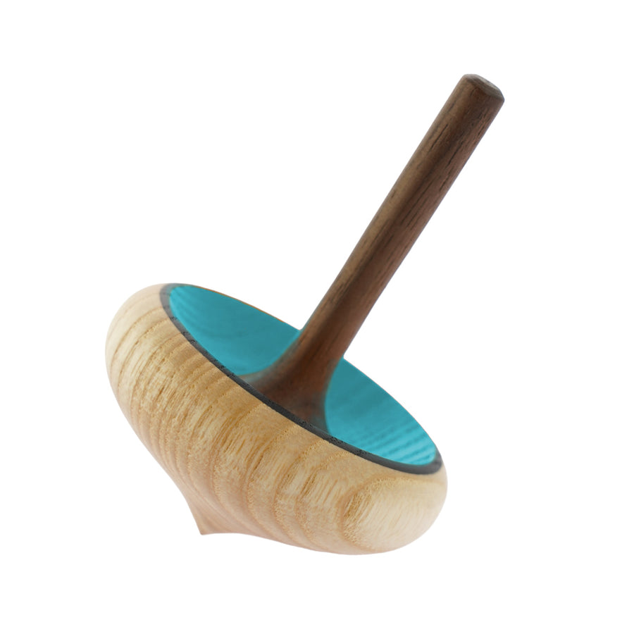 Mader handmade wooden zwirbel spinning top in blue on a white background