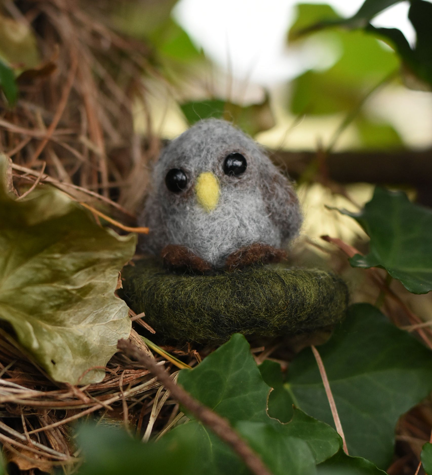 A mini felted owl figure created using The Makerss Amiguwoolli Owl Mini 
 Needle Felt Kit