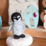 A small felted penquin figure created using The Makerss  Amiguwoolli Penguin Mini Needle Felt Kit. 