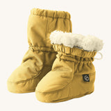 Mamalila eco-friendly winter allrounder baby booties in the mustard colour on a cream background