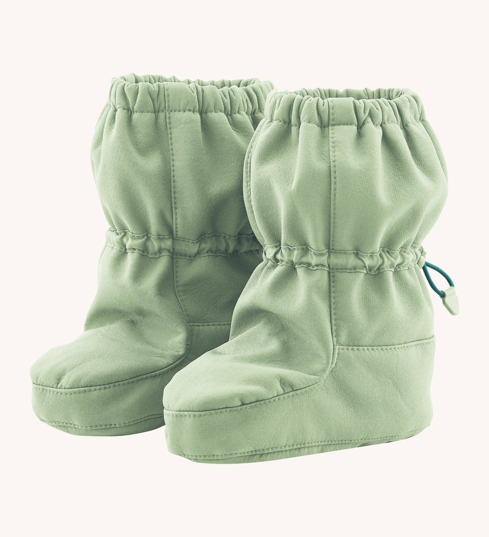 Mamalila eco-friendly toddlers allrounder winter booties in the mint green colour on a cream background