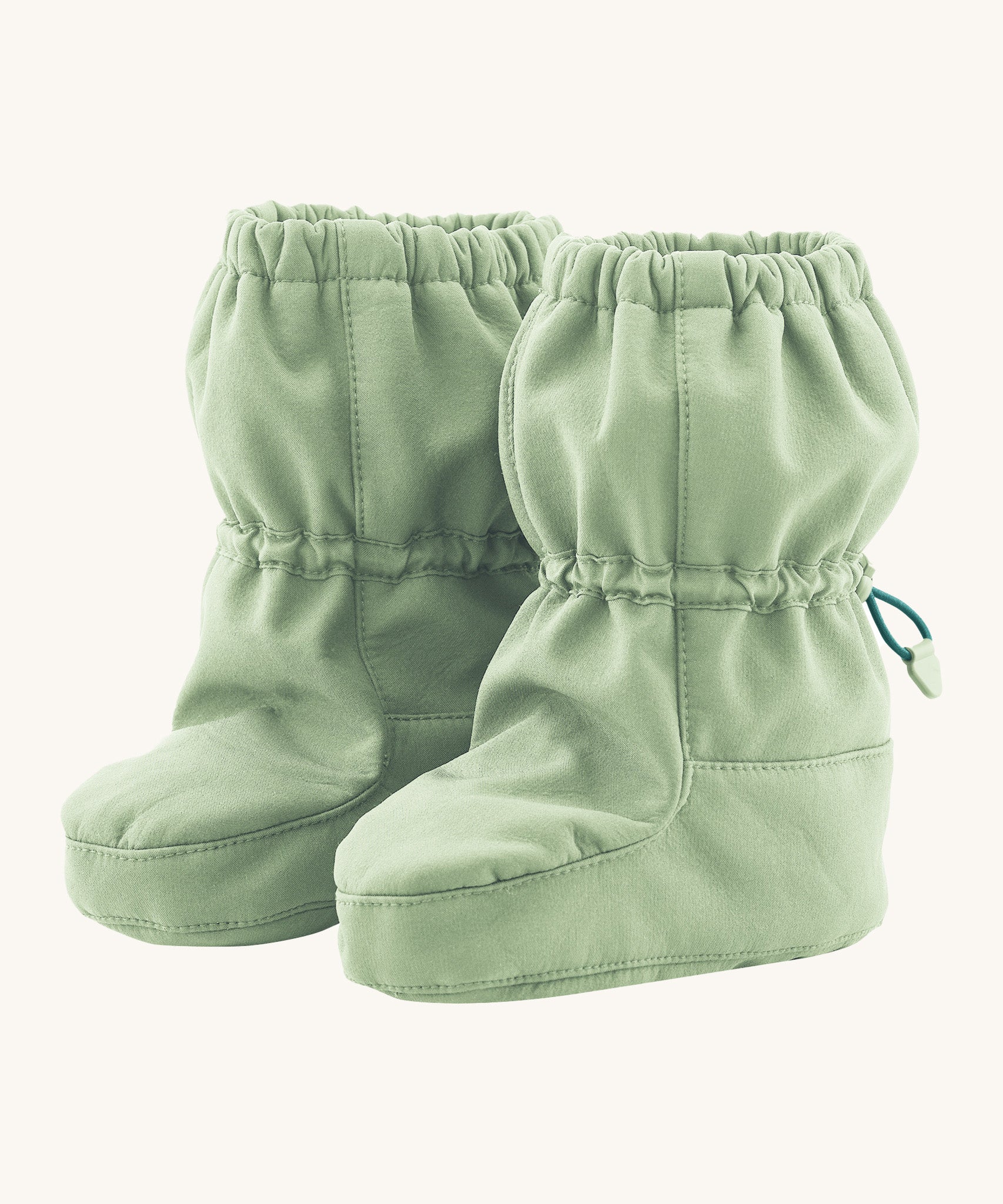 Mamalila eco-friendly toddlers allrounder winter booties in the mint green colour on a cream background