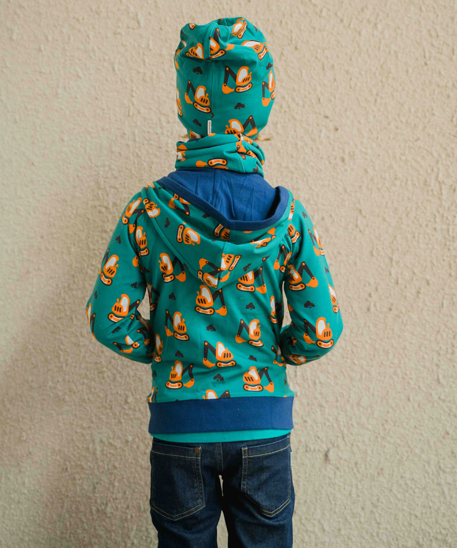 A child wearing a Maxomorra Excavator Reversible Zip Hoodie with matching hat and tube scarf. The image shows the child facing away from the camera showing the back of the hoodie. 