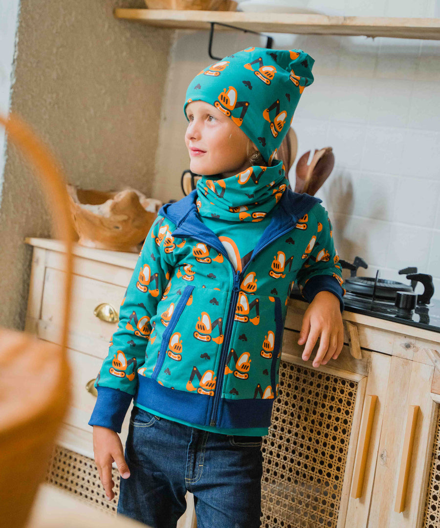 A child wearing a Maxomorra Excavator Reversible Zip Hoodie with matching hat and tube scarf.