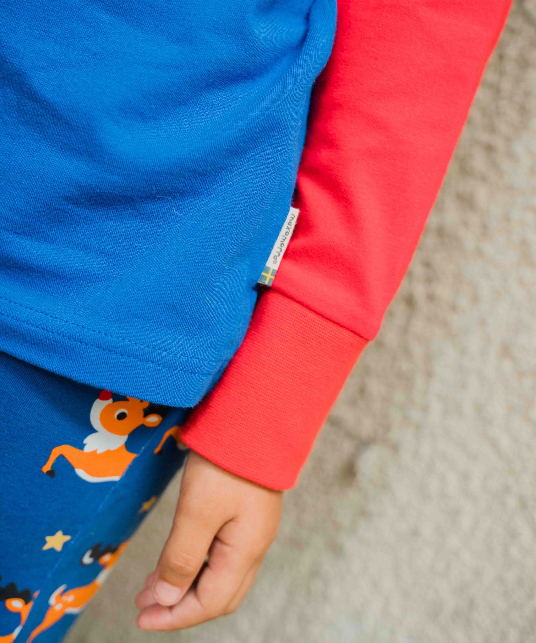 A close up of the sleeves on the Maxomorra Reindeer Raglan Long Sleeve Top. 