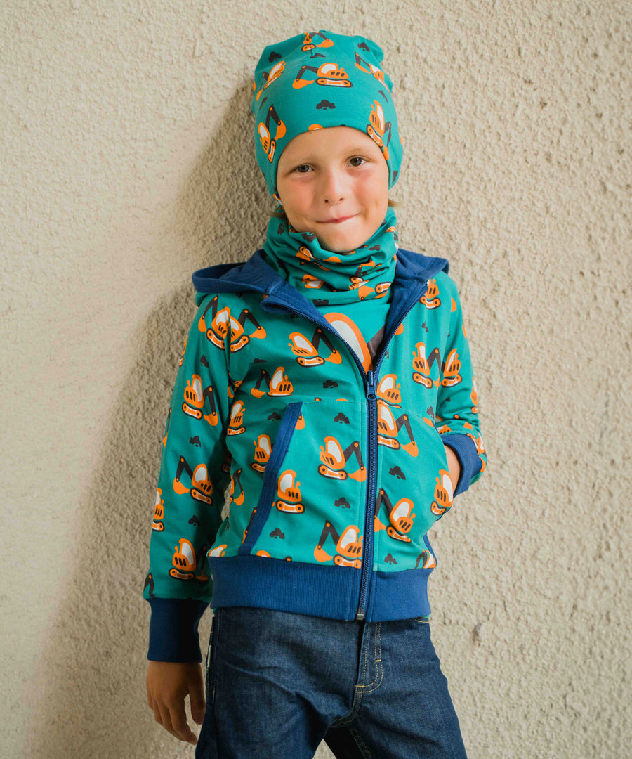 A child wearing a Maxomorra Excavator Reversible Zip Hoodie with matching hat and tube scarf.